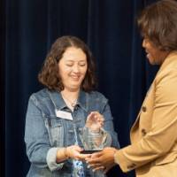 Person being handed an award